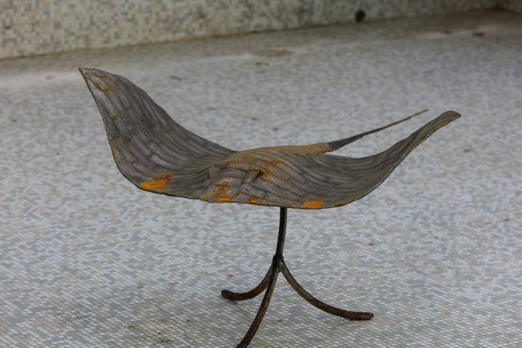A weathered metal sculpture covered in rust, Moscow, Russia.