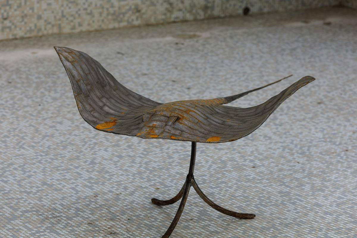 A weathered metal sculpture covered in rust, Moscow, Russia.