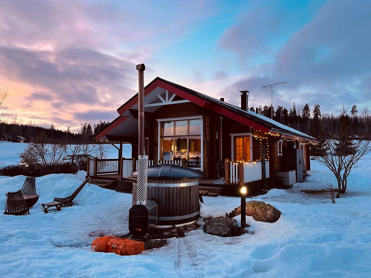 Exterior view of modern amenities cabin rental with smart security cameras and ambient pathway lighting